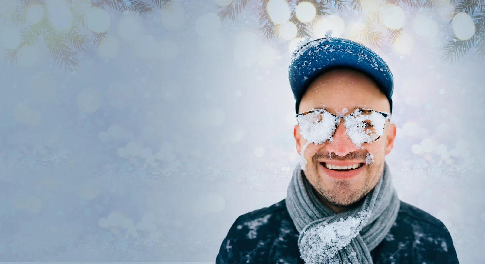 Man with snow on his glasses