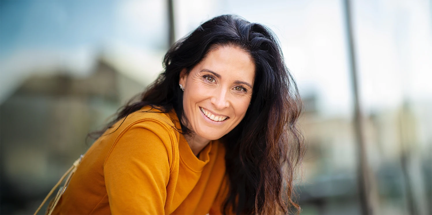 portrait of beautiful middle-aged woman in the city
