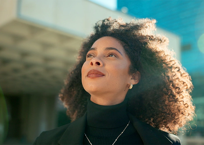 young woman with clear vision in the city after LASIK