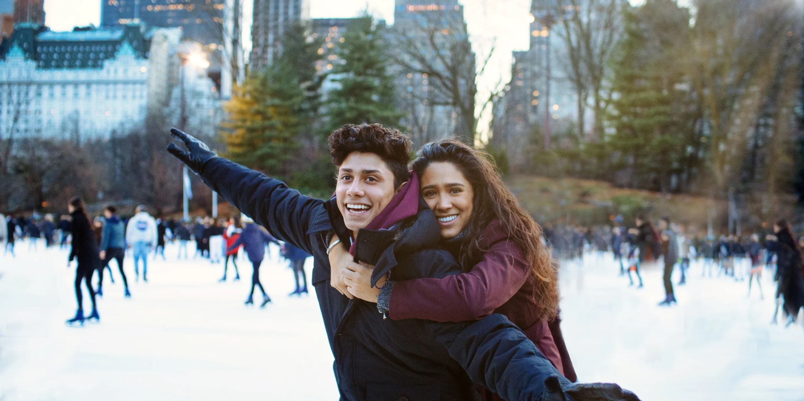happy healthy couple ice skating