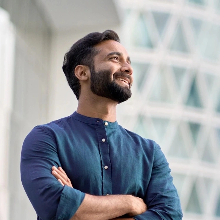 young healthy man looking out at the city