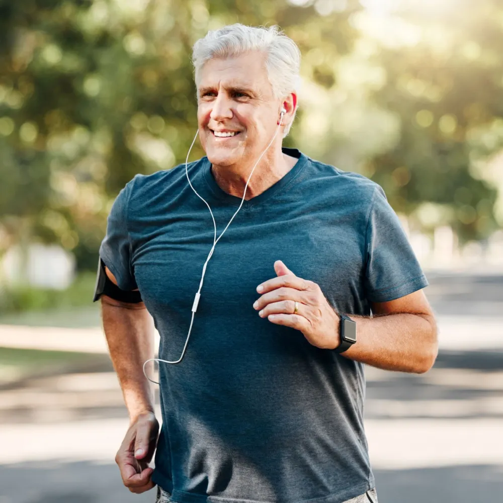 healthy senior man running outside