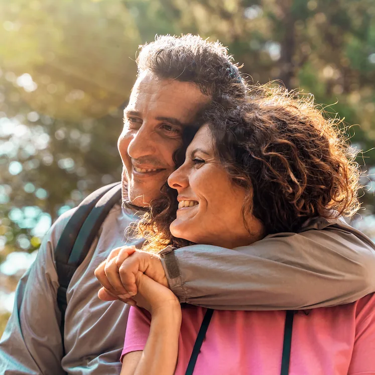 middle-aged couple enjoying the outdoors after Refractive Lens Exchange procedure