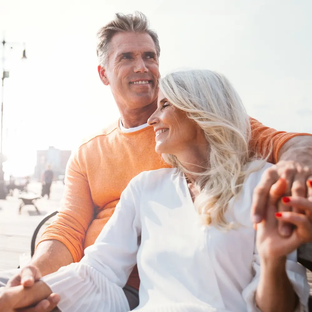 Happy senior couple spending time at the beach in New York