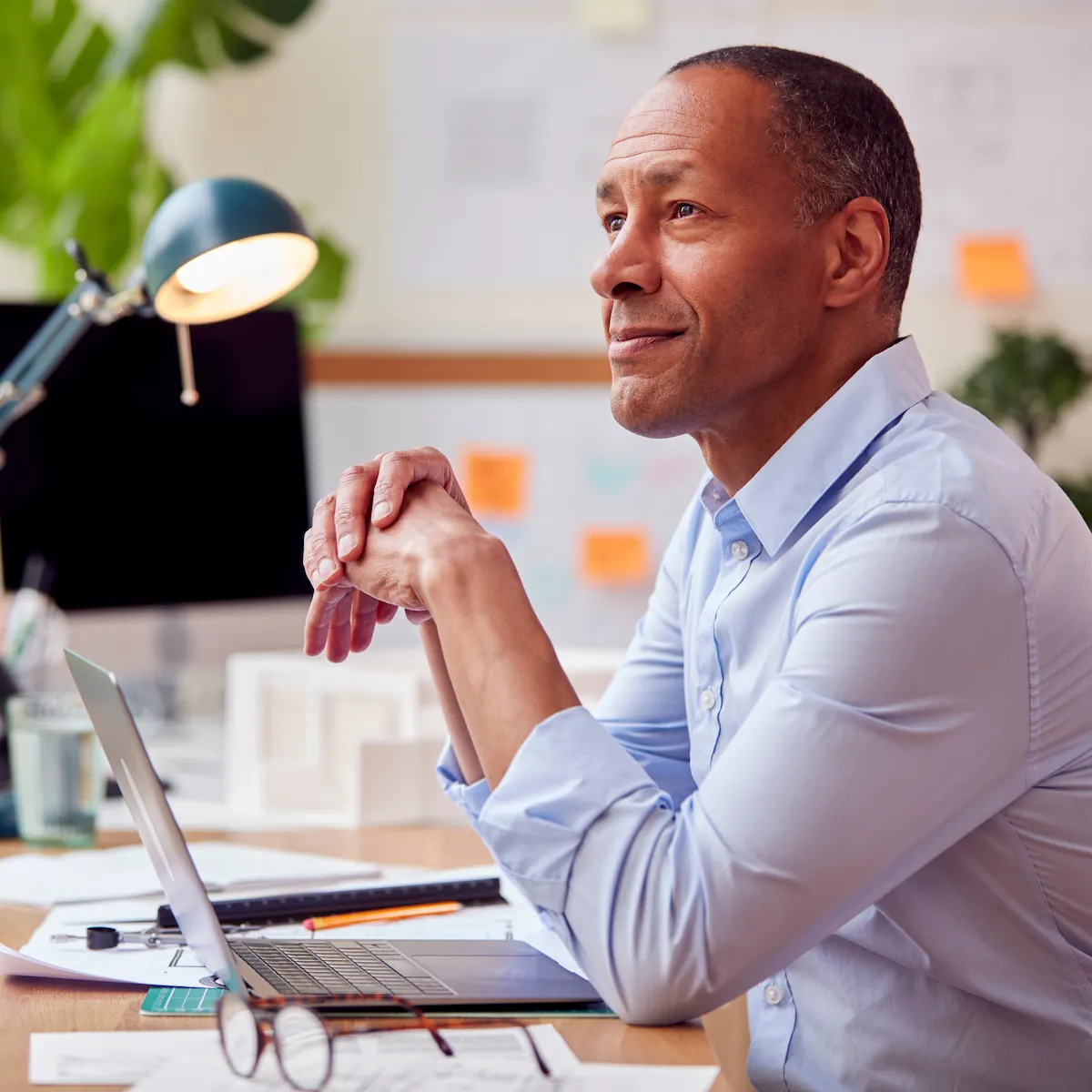 middle-aged architect working at his desk with visual freedom from glasses
